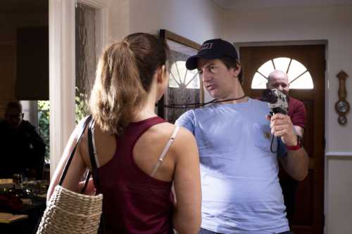 Director filming in the hallway